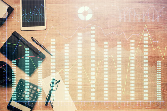 Double exposure of forex graph drawing and work table top veiw. Concept of financial analysis. © peshkova