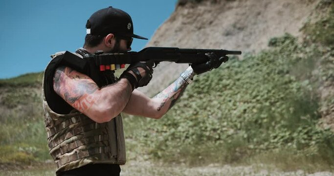 Gauge pump shotgun being fired and ejecting shells