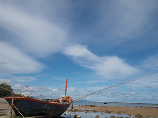 Small fishing boats of villagers in the area parked on Phla beach, Rayong province after going out...