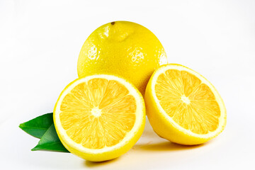 Fresh juicy lemon with leaves, isolated on white background