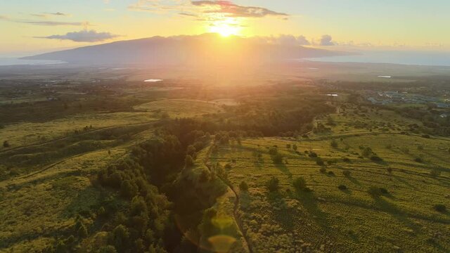 Drone aerial shot 4k. Maui Hawaii island seen from above. Summer vacation travel in America. Sunset light.