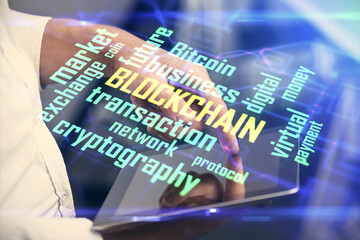 Double exposure of man's hands holding and using a phone and crypto currency blockchain theme drawing.