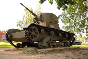 Old tank under the trees, participated in the 2nd world war.