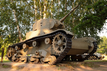 Old tank under the trees, participated in the 2nd world war.