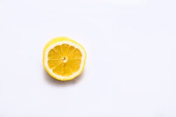 Fresh and juicy lemons cut on white background