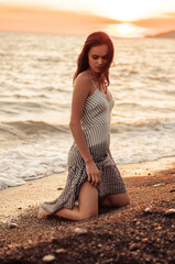 Fototapeta na wymiar Tropical Portrait of Young Beautiful woman on the beach on the sea ocean in dress 