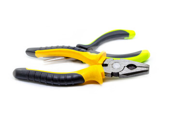Obraz premium yellow pliers pair of hand tools bright white background repair construction