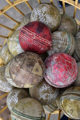 Obraz premium Used balls of cricket sport kept in basket.