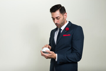 Portrait of handsome bearded businessman in suit