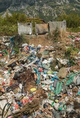 Garbage container full with garbage. Full garbage containers. A bunch of junk, garbage and waste in the city. The urban waste problem