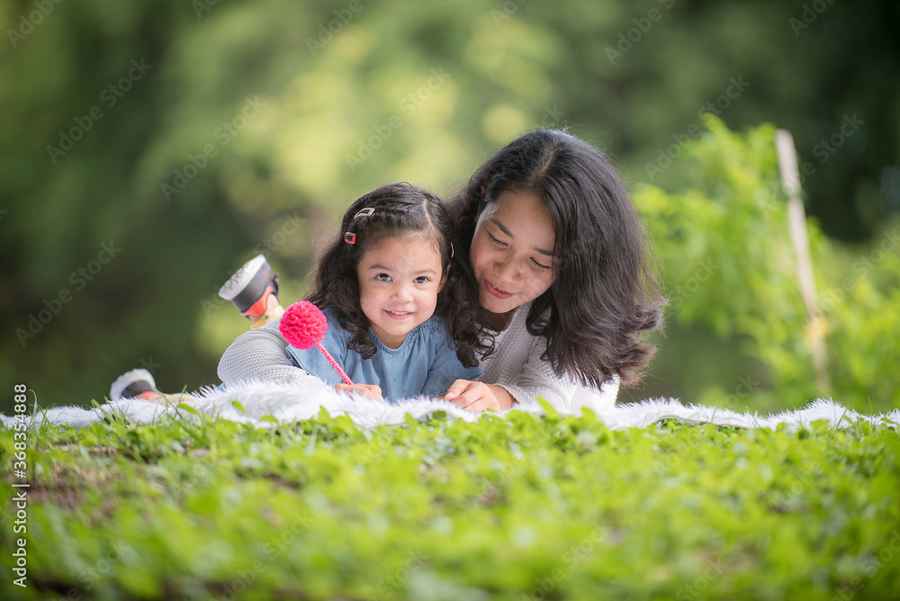 Wall mural portrait girl child and mother woman