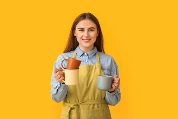 Female barista on color background