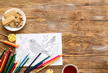Composition with coloring picture on table