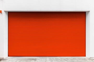 Automatic red roller shutter doors on the ground floor of the house