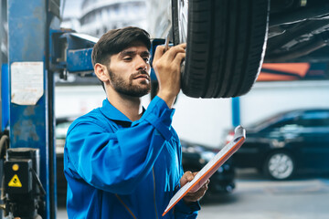 close up view mechanic checking car maintenance list jobs and notes detail of repairs part in the...