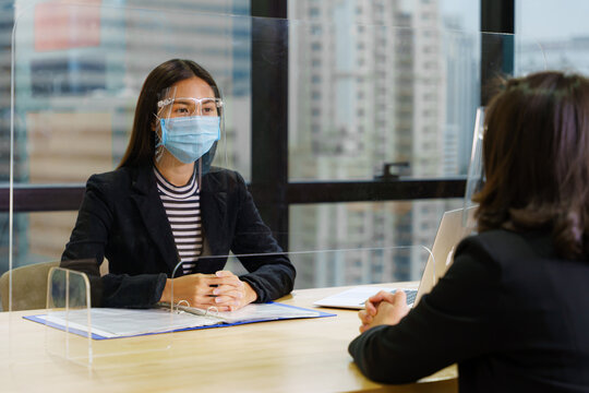 business new normal to use face mask or face shield or clear partition