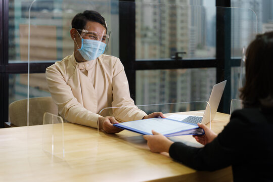 business new normal to use face mask or face shield or clear partition