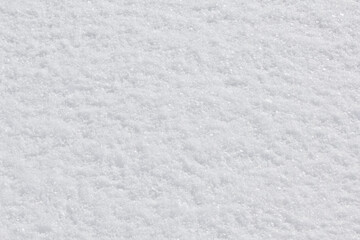 Texture of fresh snow covering the ground in winter .