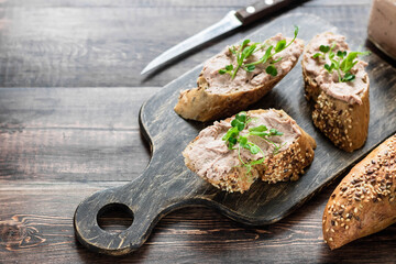 Turkey liver pate on whole grain baguette with microgreens