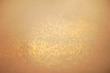 Vintage abstract yellow background with small bokeh defocused lights.