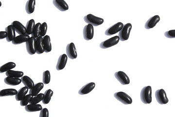 Black beans on white background.
