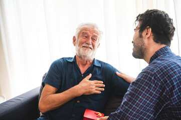 senior bearded father and adult son talking at home, 2 moustache hipster man and family concept