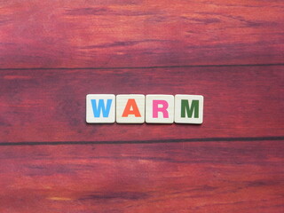 Word Warm on wood background