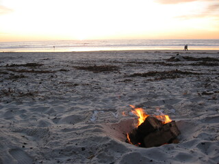 Fototapeta na wymiar Beach bonfire at day's end
