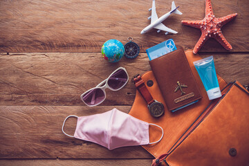 Protecting COVID-19 while Traveling. Travel accessories costumes. Passports, luggage, The cost of...