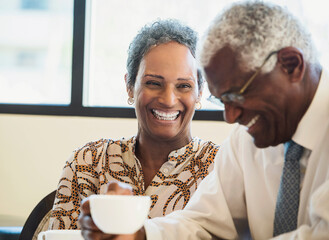 happy senior couple drinking coffee