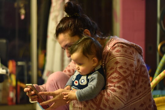 
Mother And Son Checking A Cell Phone