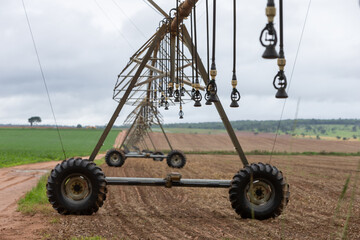 center pivot agricultural irrigation system watering on a farm