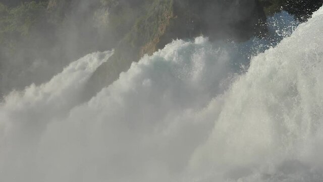 The beautiful strong waters of the Rhein Falls in Neuhausen, Switzerland - slow motion