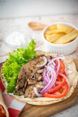gyro wrap on wooden cutting board