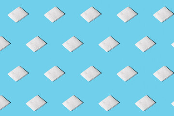 Trendy pattern from clean napkins. Clean paper towels with soft shadow. Isometric pattern on blue background.