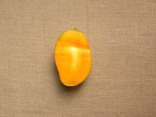 Cut half of yellow color ripe fresh Mallika mango