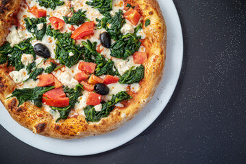 pizza on the black background, top view