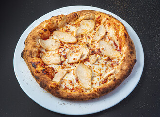 pizza on the black background, top view