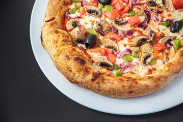 pizza on the black background, top view