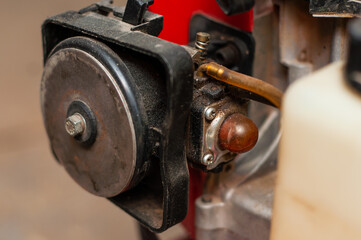 Carburetor and air filter of a two-stroke engine of a walk-behind tractor