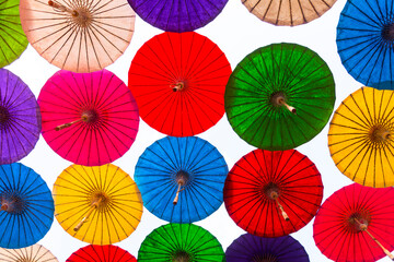 Fototapeta na wymiar Colorful umbrellas, Paper Parasols umbrellas background & Textures, Thai crafts.