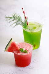 Red watermelon smoothie and green cocktail drink