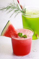 Red watermelon smoothie and green cocktail drink
