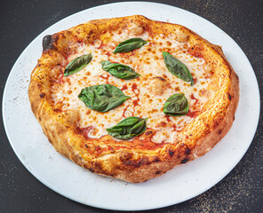 pizza on the black background, top view