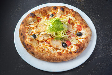 pizza on the black background, top view
