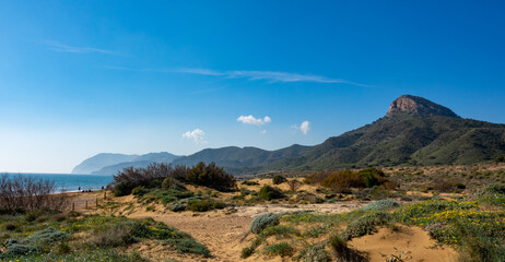 Green mountains and sandy beaches of regional park of Calblanque, Monte de las Cenizas and Peña del Aguila in Spain