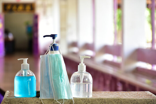 New normal, hand sanitizer, alcohol gel and hand soap on table in front of classroom. Concept for pretecting and preventing coronavirus or covid-19 and germs.