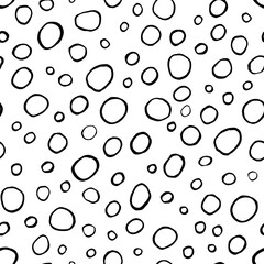 Hand-drawn pattern background with black circles on white. Hand-drawn seamless pattern. Vector isolated illustration.
