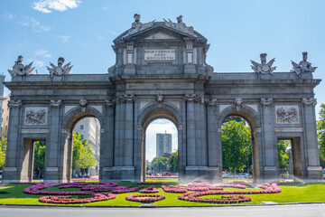 Fototapeta premium The Alcala Door (Puerta de Alcala) is a gate in the center of Madrid, Spain. It is the landmark of the city.