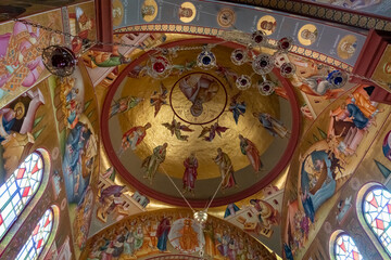 Fototapeta na wymiar The ceiling dome with religious drawings in the Church of the Apostles located on the shores of the Sea of Galilee, not far from Tiberias city in northern Israel